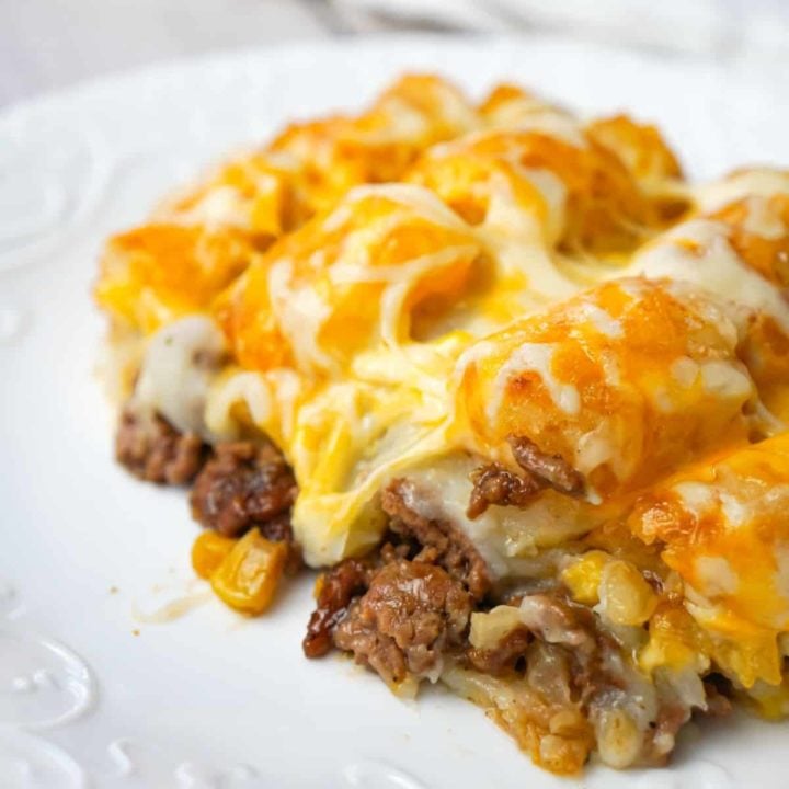 Shepherd's Pie Tater Tot Casserole is a hearty casserole with ground beef, corn and diced onions topped with mashed potatoes, tater tots and shredded cheese.