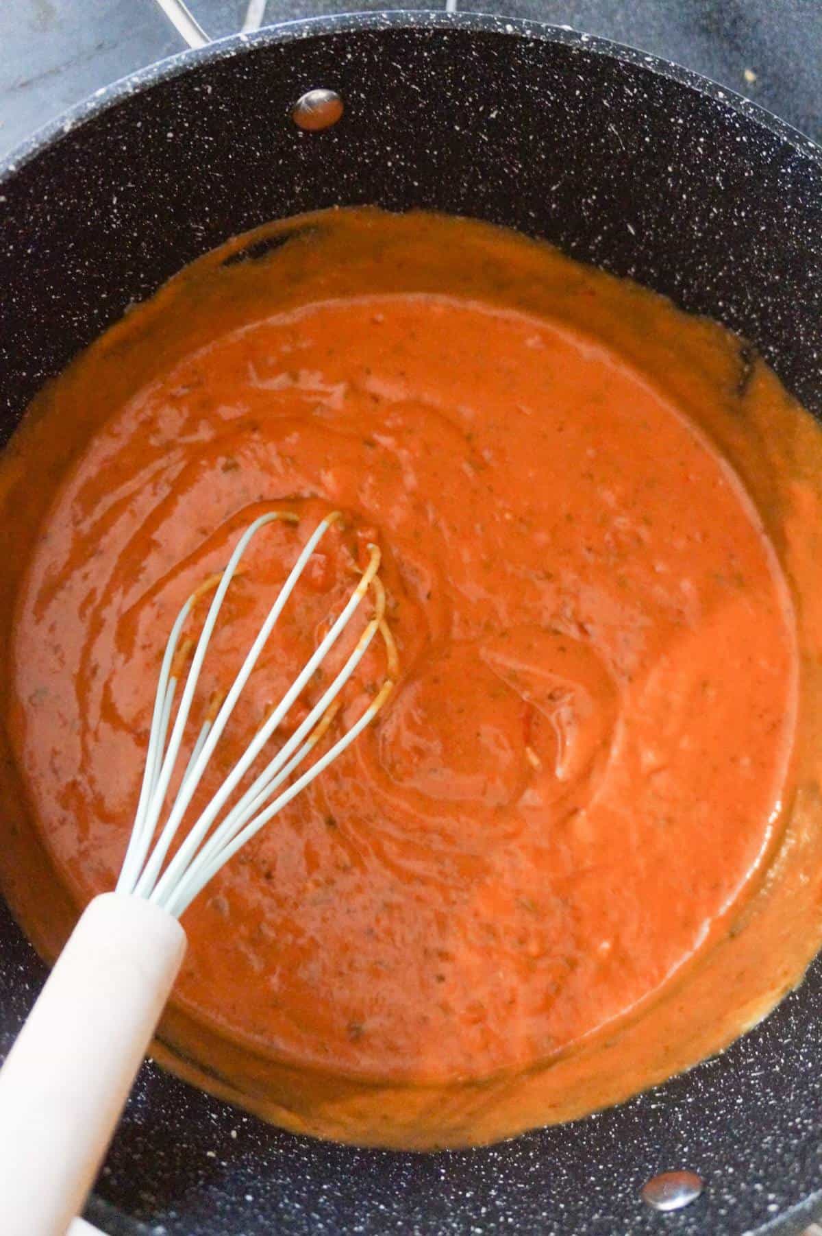 tomato basil pasta sauce and cream of soup mixture in a large pot