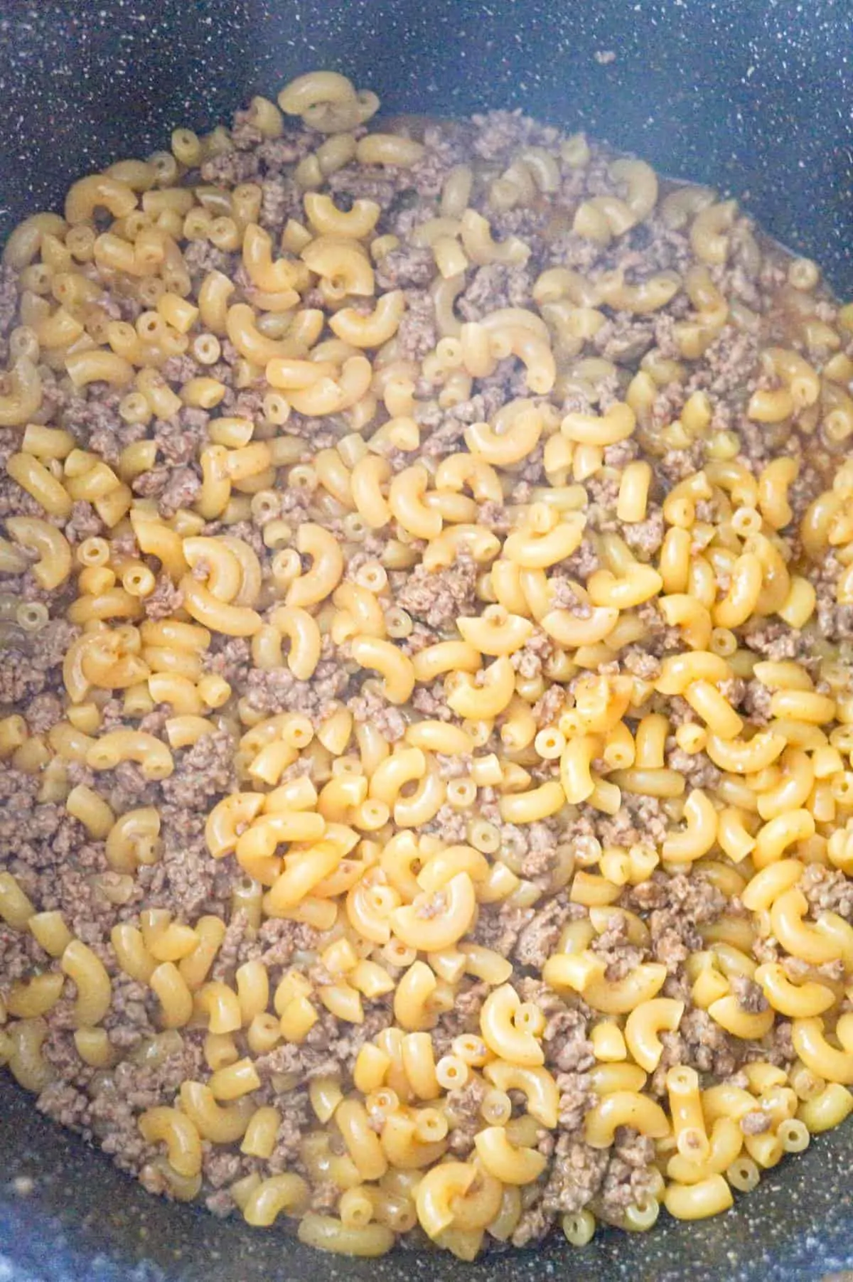 cooked ground beef and macaroni in a large pot