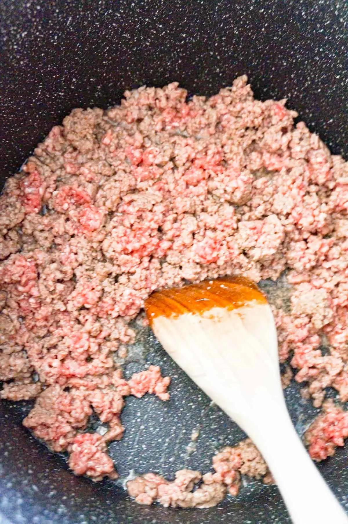 ground beef cooking in a large pot
