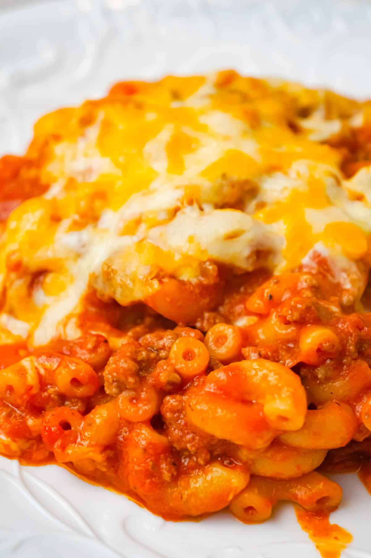 Baked Chili Mac and Cheese is an easy pasta recipe loaded with ground beef, tomato sauce, salsa and a shredded Tex Mex cheese blend.