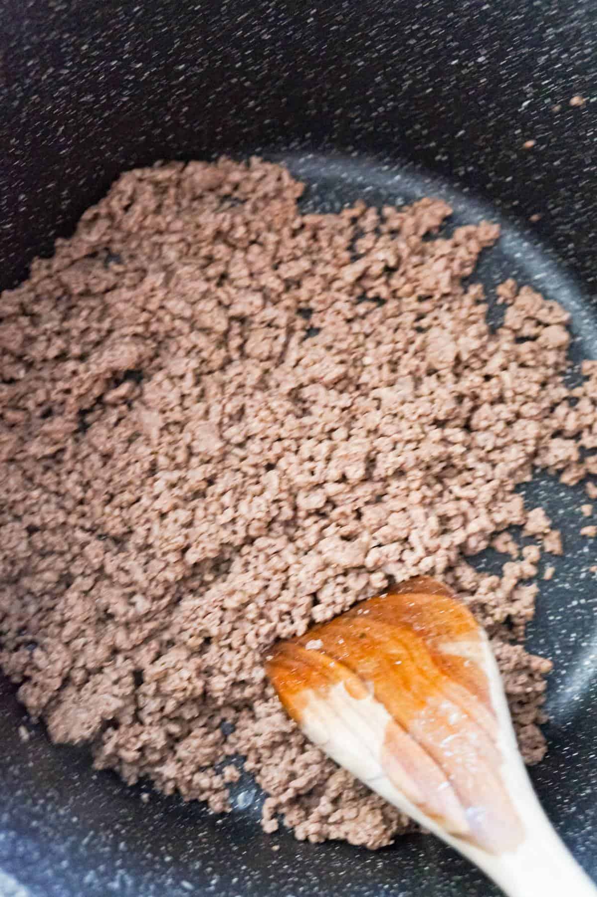cooked ground beef in a large pot