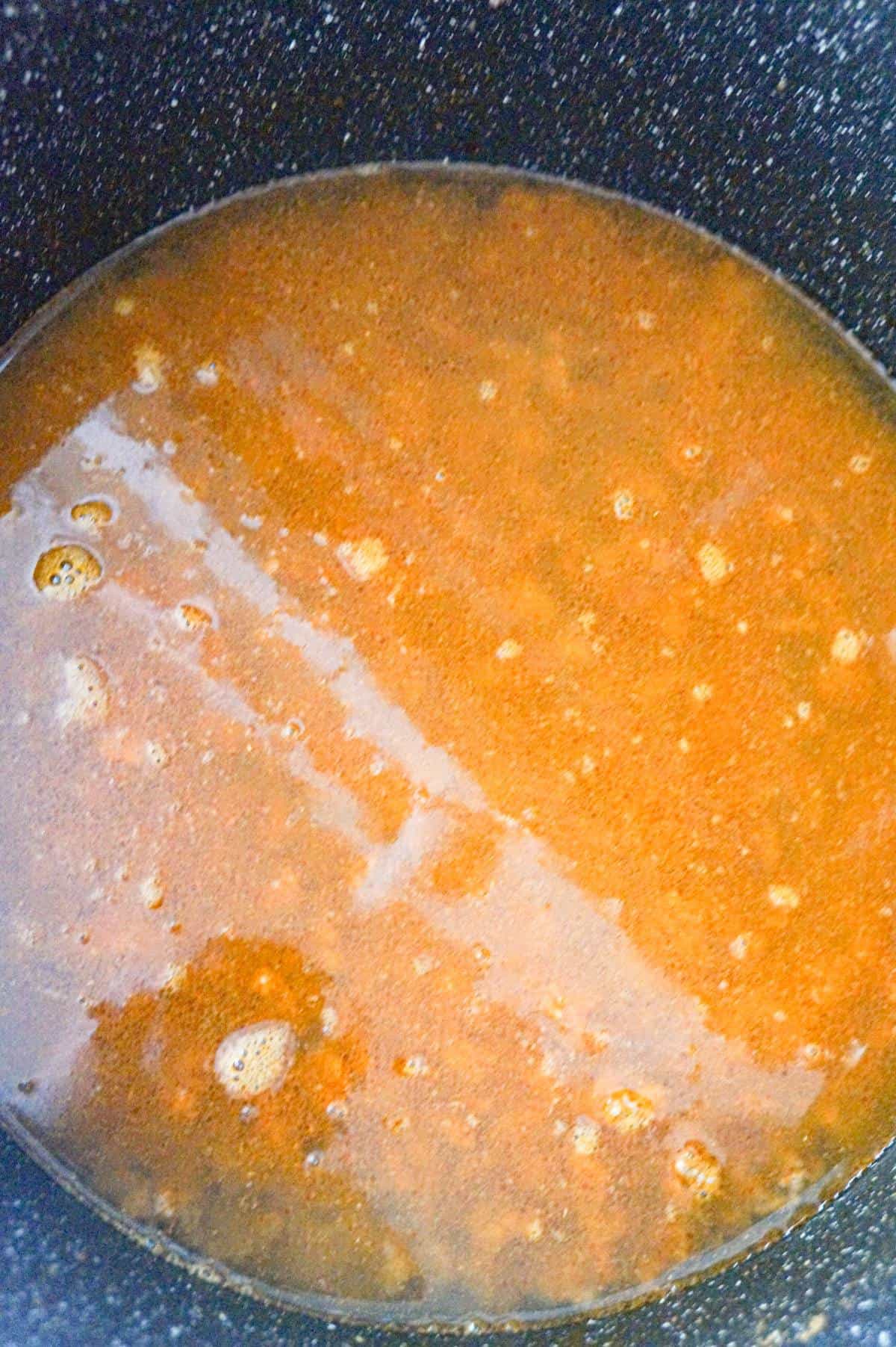 water and chili seasoning in a large pot
