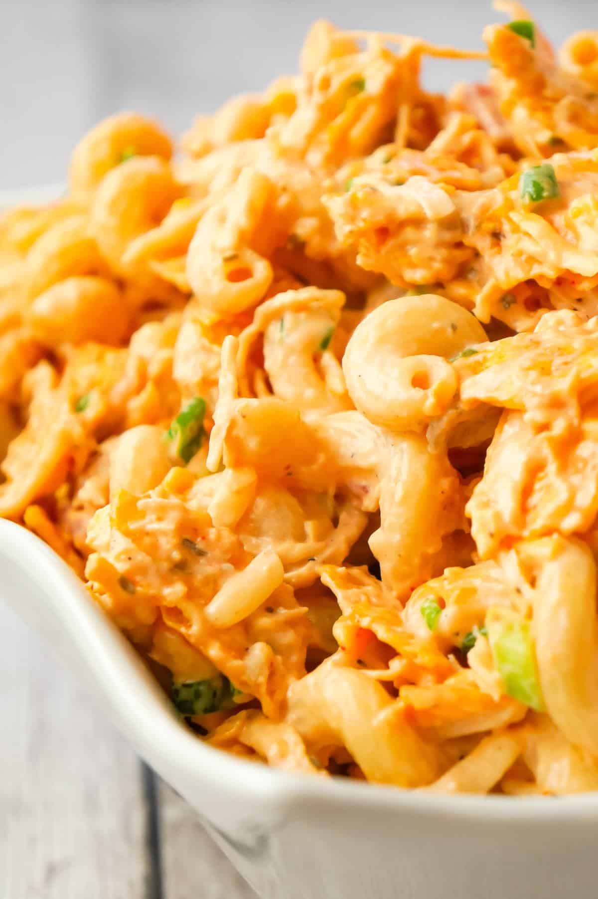 Doritos Chicken Pasta Salad is a tasty cold side dish recipe loaded with shredded chicken, chopped green onions, ranch dressing, salsa, shredded cheese and crumbled Doritos.