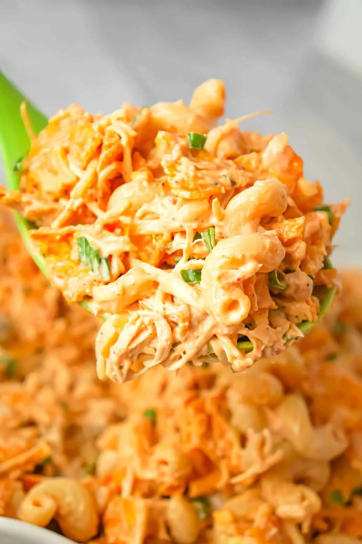 Doritos Chicken Pasta Salad is a tasty cold side dish recipe loaded with shredded chicken, chopped green onions, ranch dressing, salsa, shredded cheese and crumbled Doritos.