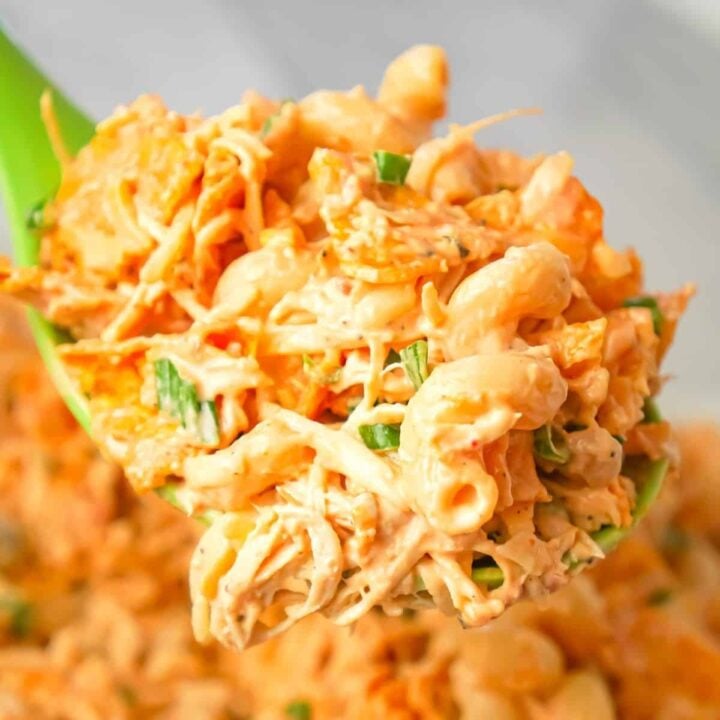 Doritos Chicken Pasta Salad is a tasty cold side dish recipe loaded with shredded chicken, chopped green onions, ranch dressing, salsa, shredded cheese and crumbled Doritos.