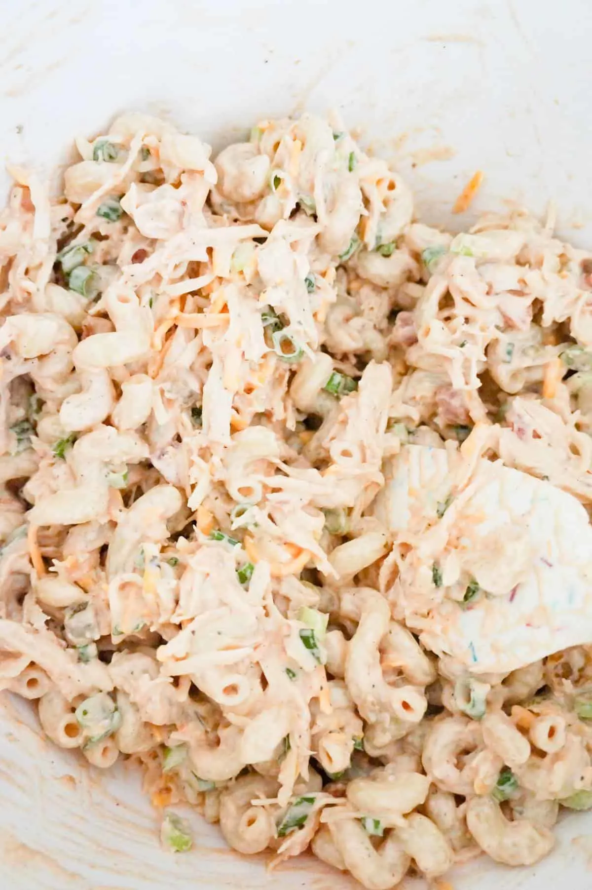 chicken pasta salad in a mixing bowl