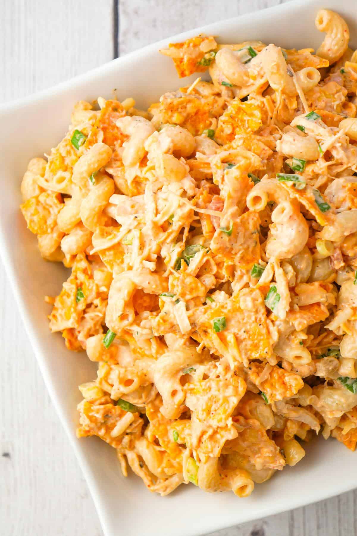 Doritos Chicken Pasta Salad is a tasty cold side dish recipe loaded with shredded chicken, chopped green onions, ranch dressing, salsa, shredded cheese and crumbled Doritos.