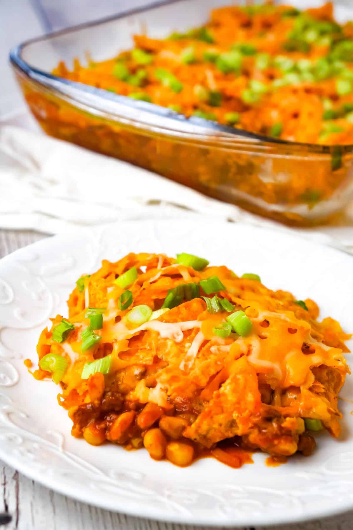 Doritos Chili Pie is an easy ground beef casserole recipe loaded with chili sauce, chunky salsa, corn, shredded cheese, crumbled Doritos and chopped green onions.