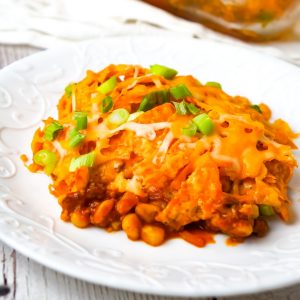 Doritos Chili Pie is an easy ground beef casserole recipe loaded with chili sauce, chunky salsa, corn, shredded cheese, crumbled Doritos and chopped green onions.