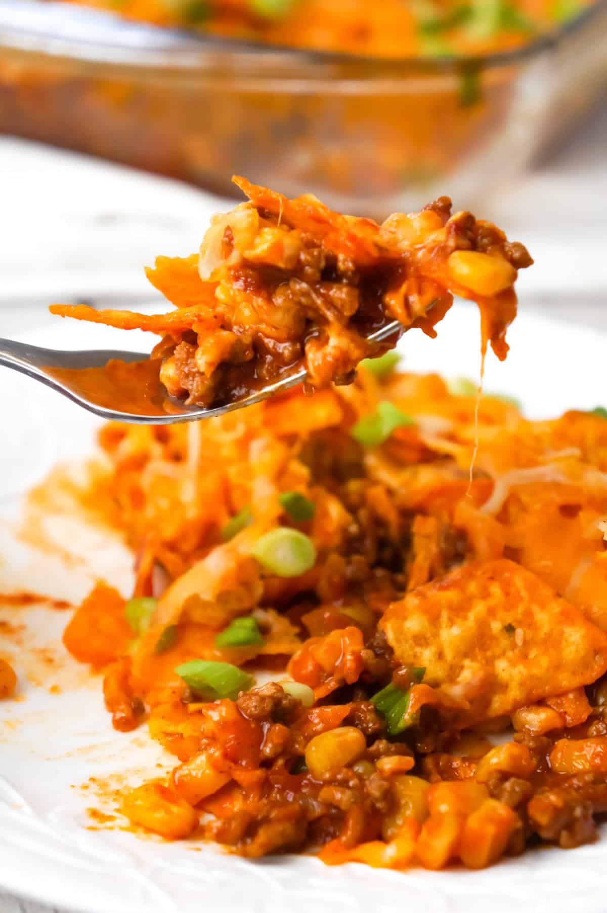 Doritos Chili Pie is an easy ground beef casserole recipe loaded with chili sauce, chunky salsa, corn, shredded cheese, crumbled Doritos and chopped green onions.