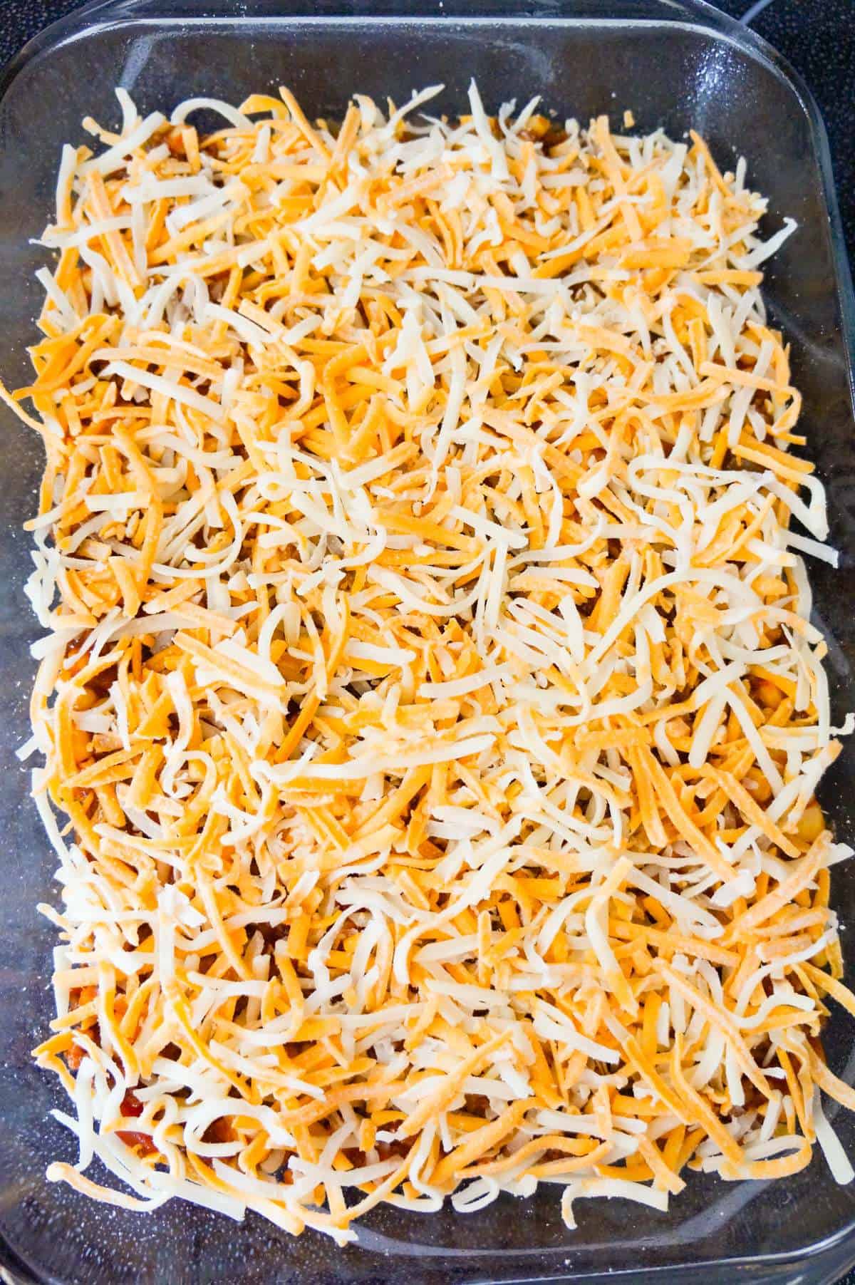 shredded cheese on top of chili pie
