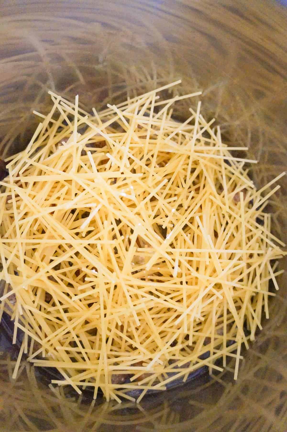 uncooked spaghetti noodles in an Instant Pot