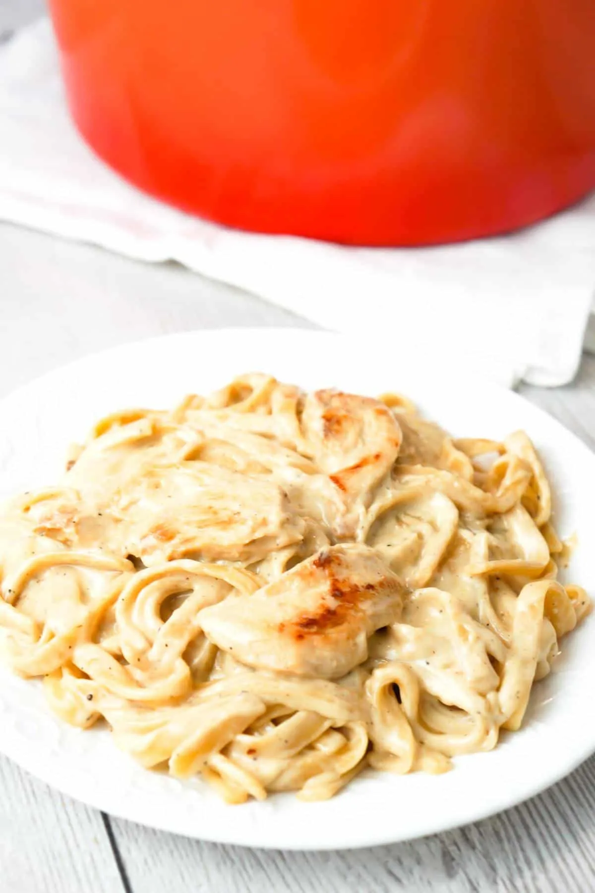 One Pot Fettuccine Alfredo with Chicken is an easy and delicious pasta recipe with a creamy garlic Parmesan sauce and loaded with slices of chicken breast.