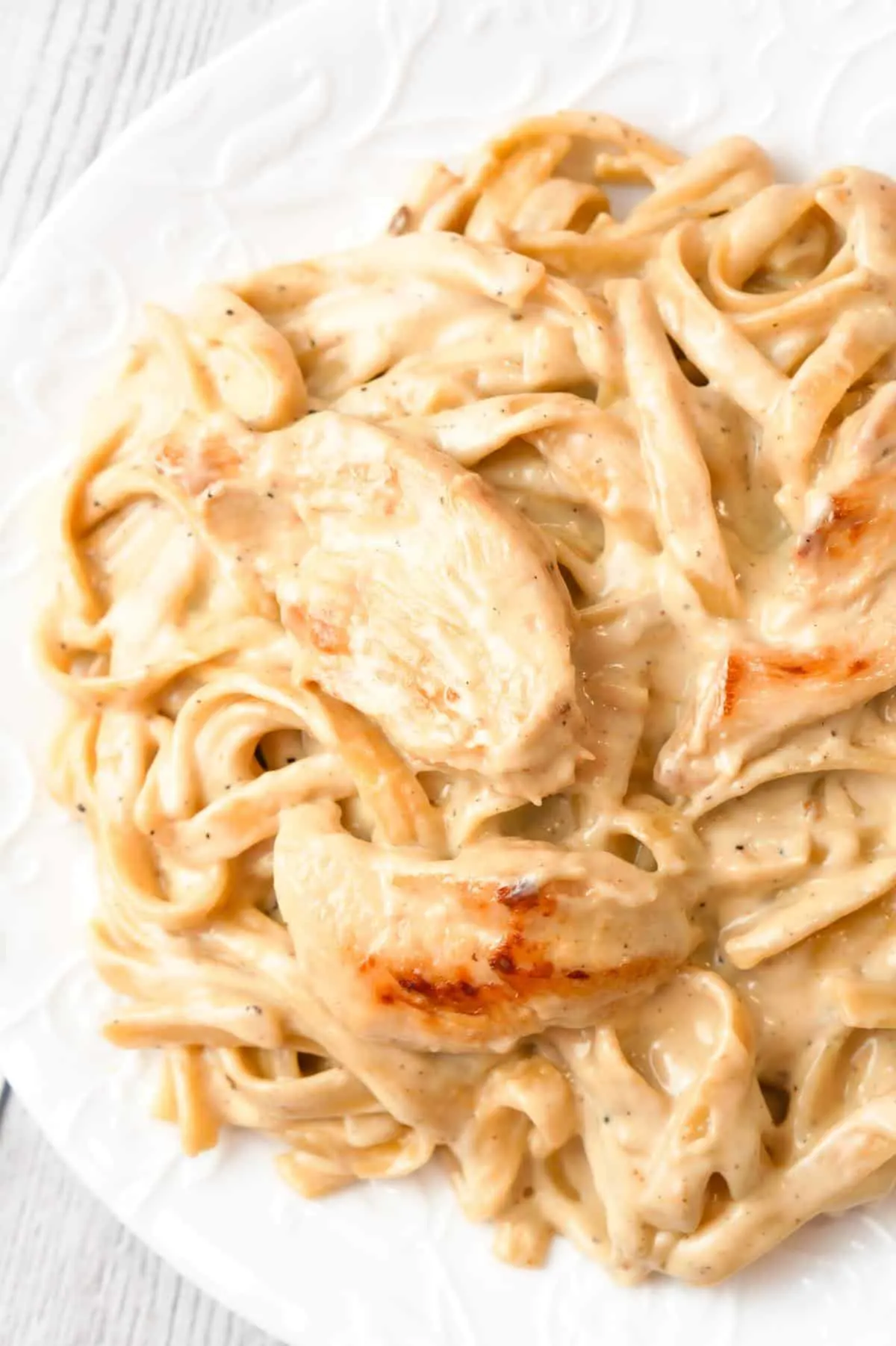 One Pot Fettuccine Alfredo with Chicken is an easy and delicious pasta recipe with a creamy garlic Parmesan sauce and loaded with slices of chicken breast.
