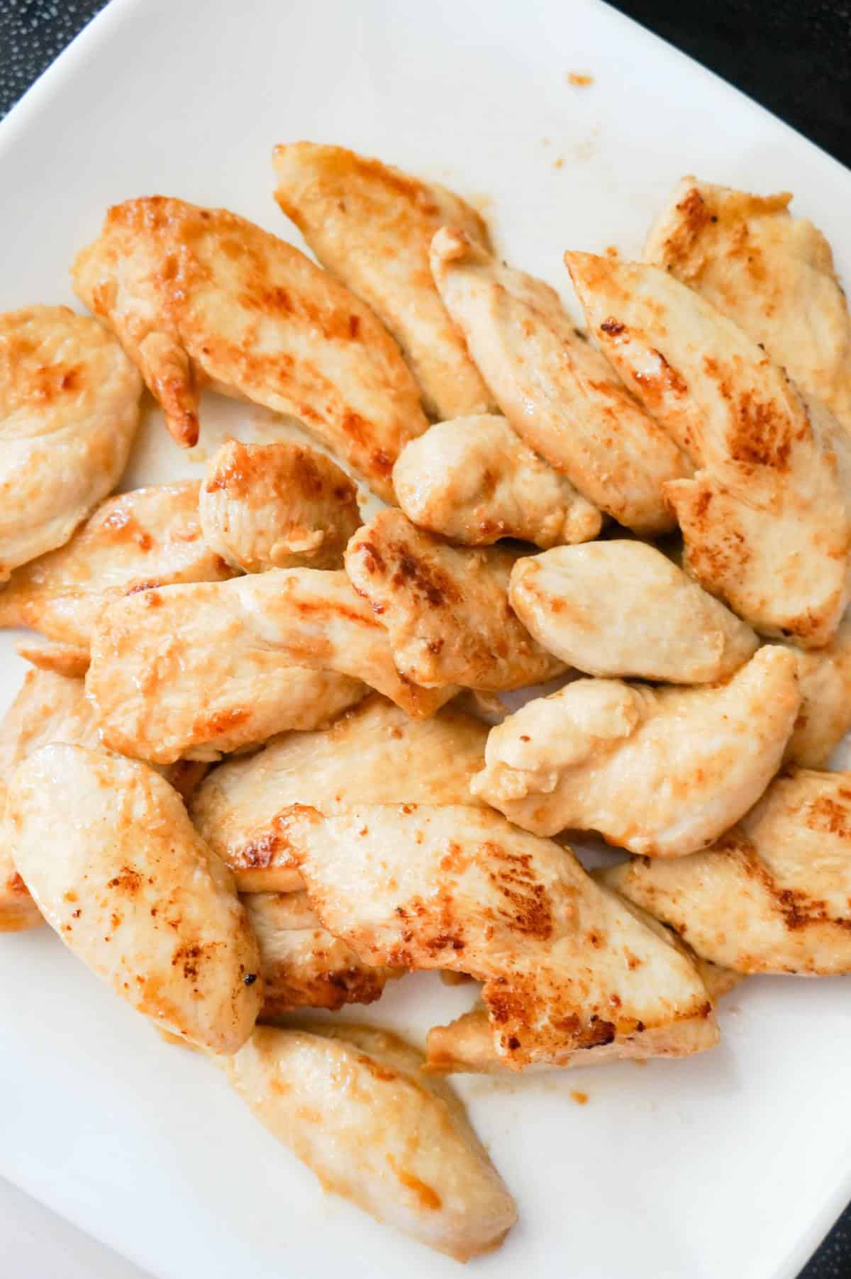 cooked chicken breast slices on a plate