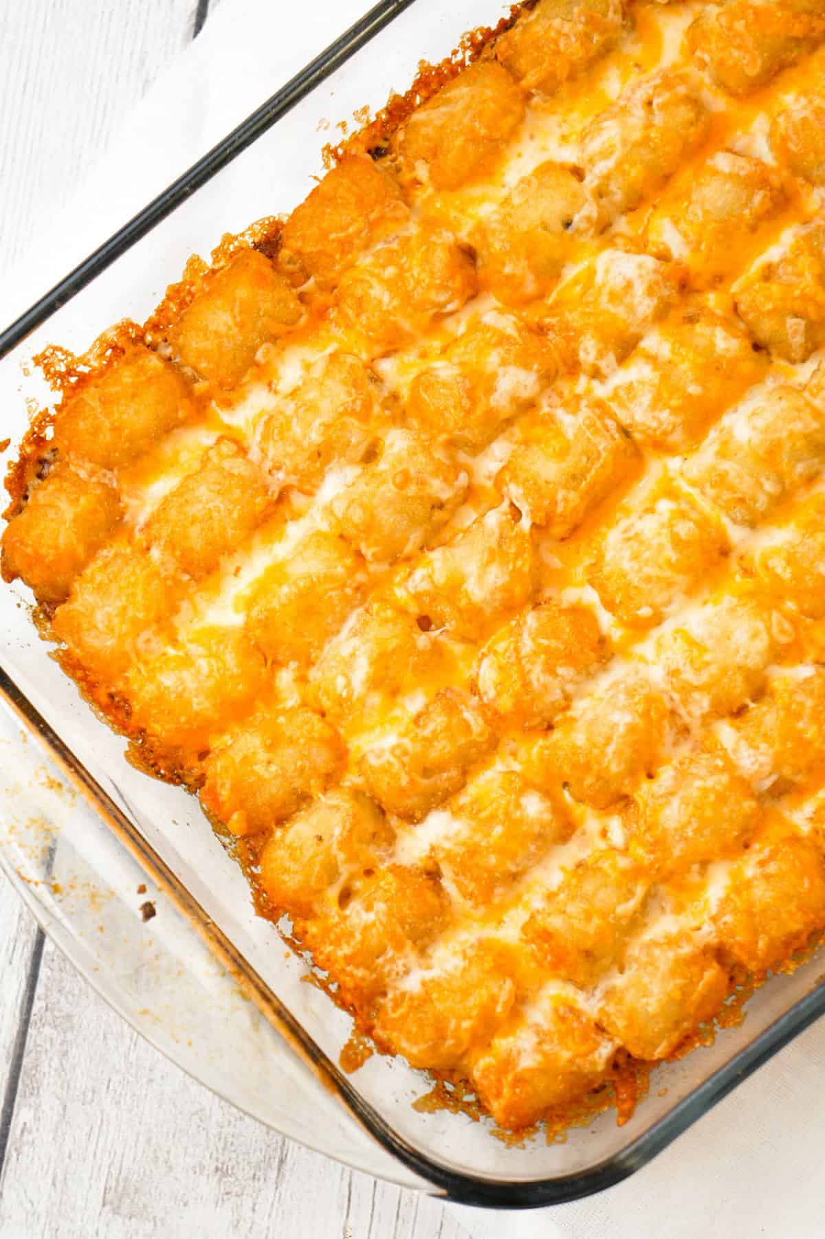 Sloppy Joe Tater Tot Casserole is an easy dinner recipe with a ground beef sloppy joe base, topped with cheese and tater tots.