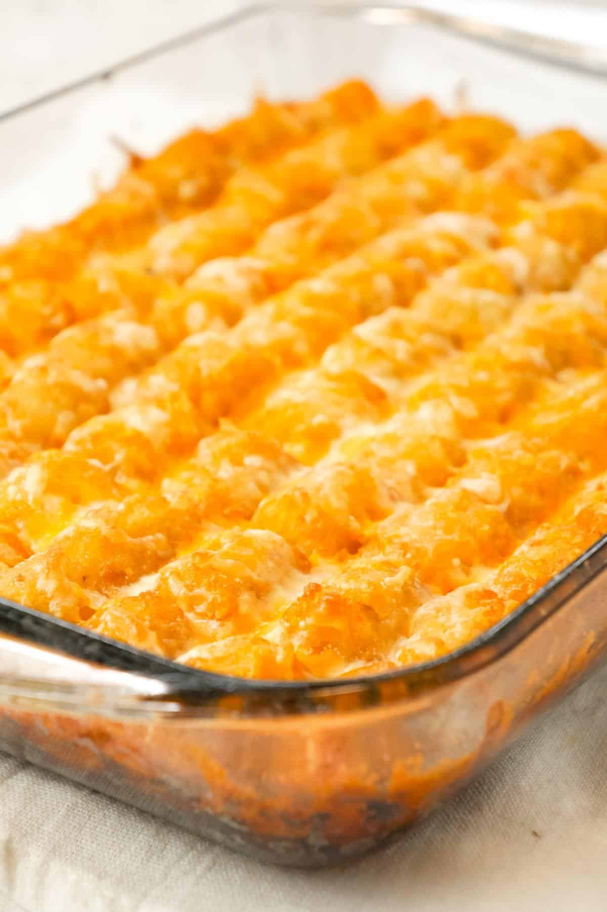 Sloppy Joe Tater Tot Casserole is an easy dinner recipe with a ground beef sloppy joe base, topped with cheese and tater tots.