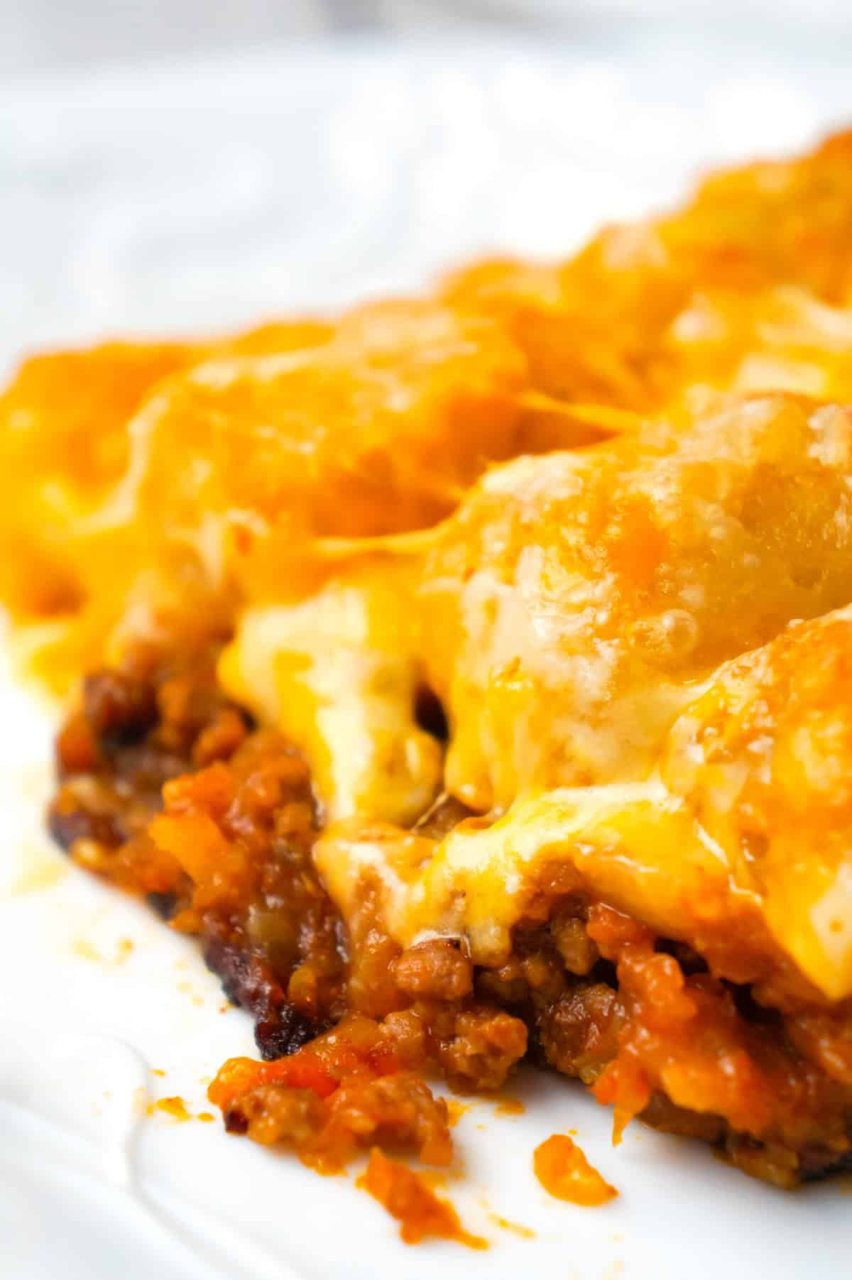 Sloppy Joe Tater Tot Casserole is an easy dinner recipe with a ground beef sloppy joe base, topped with cheese and tater tots.