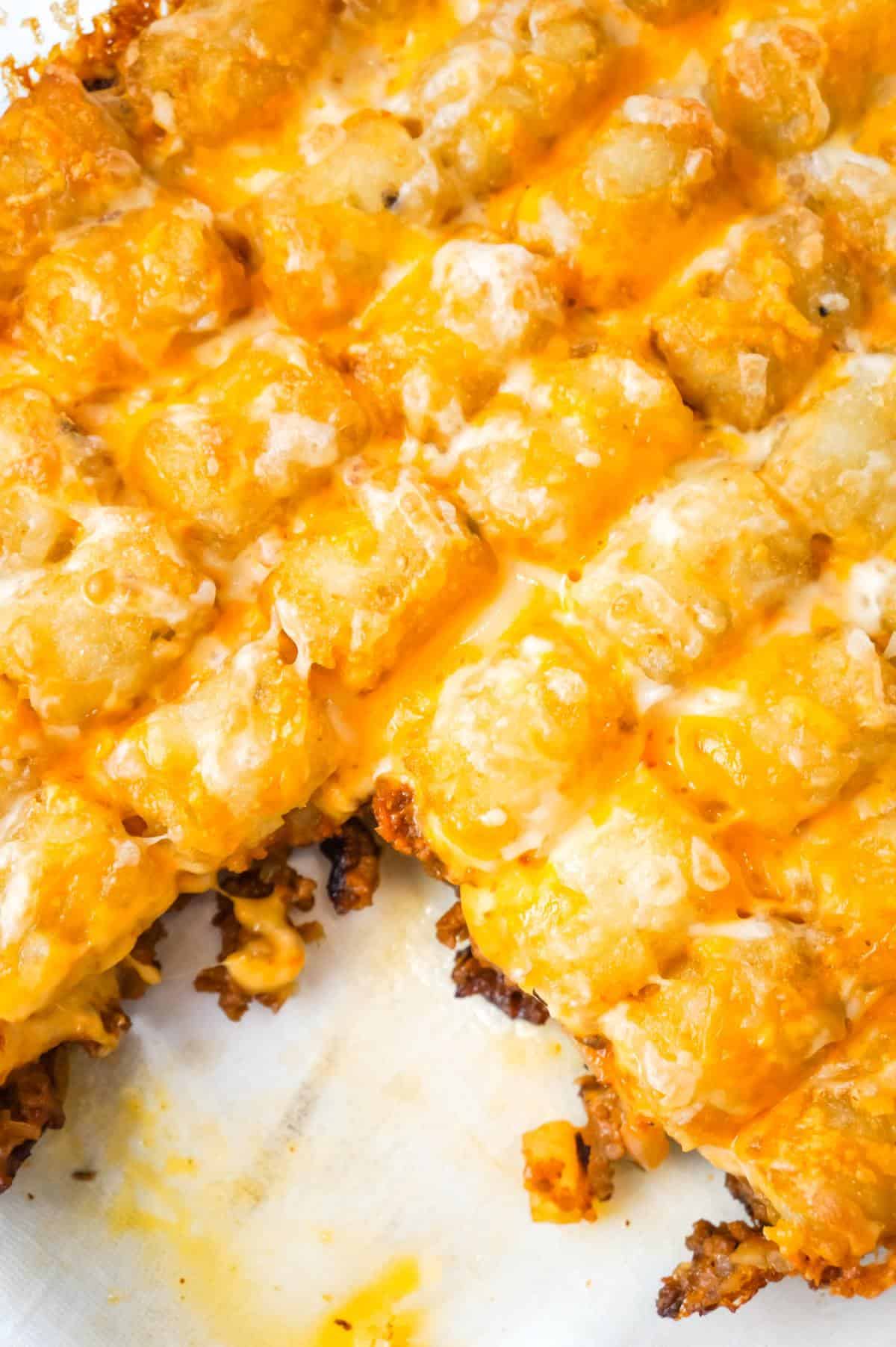 Sloppy Joe Tater Tot Casserole is an easy dinner recipe with a ground beef sloppy joe base, topped with cheese and tater tots.