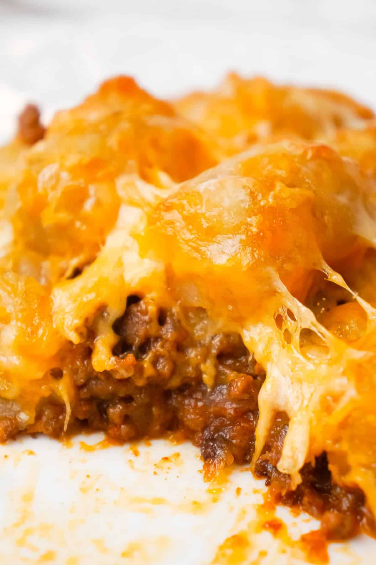 Sloppy Joe Tater Tot Casserole is an easy dinner recipe with a ground beef sloppy joe base, topped with cheese and tater tots.
