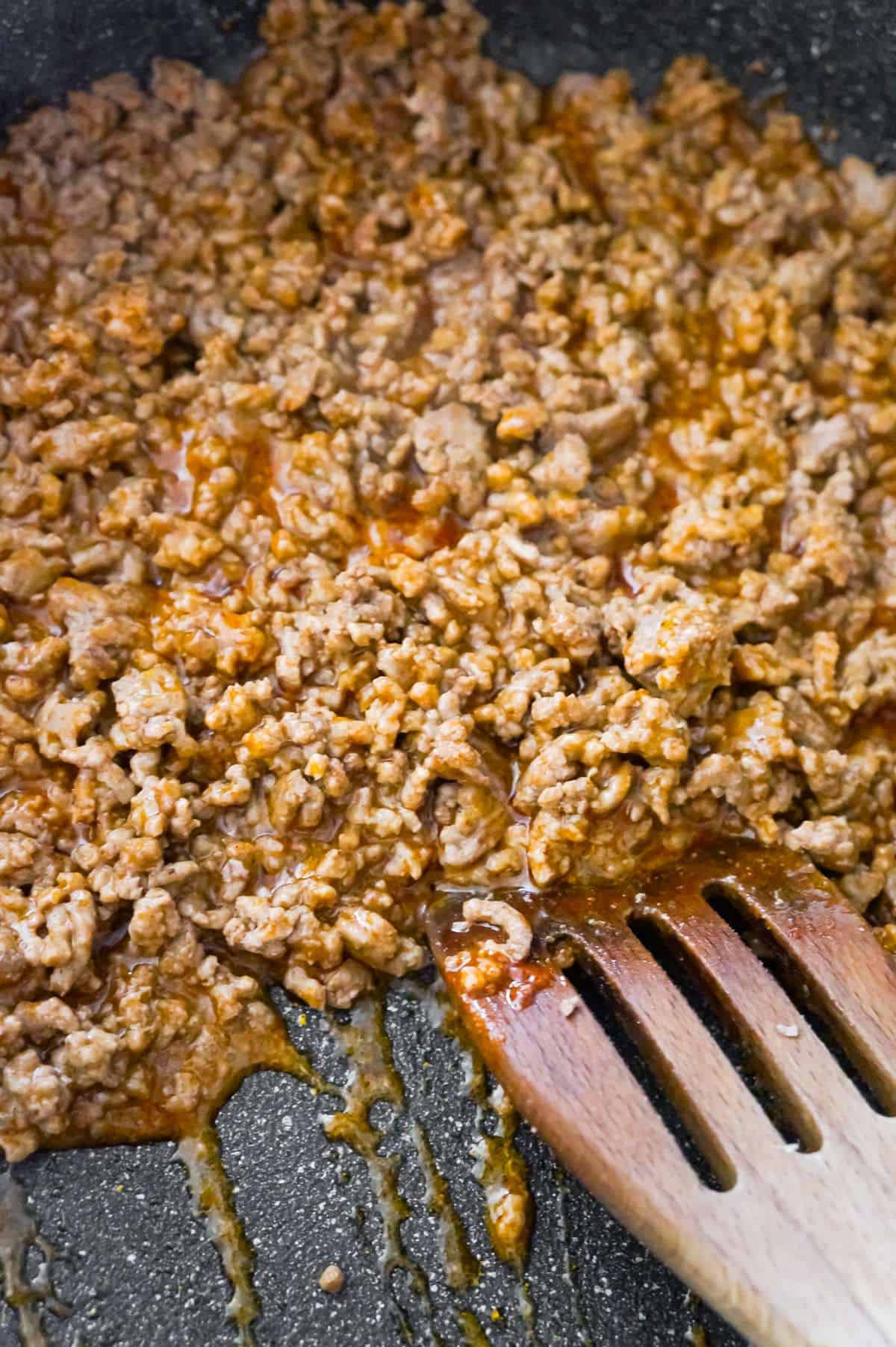 ground beef tossed in taco seasoning in a saute pan