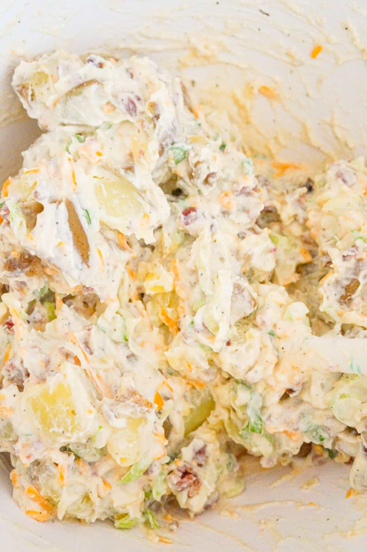 cheddar bacon ranch potato salad in a mixing bowl