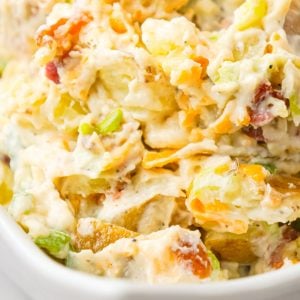 Cheddar Bacon Ranch Potato Salad is a creamy cold side dish recipe made with Yukon gold potatoes and loaded with crumbled bacon, cheddar cheese, chopped green onions, mayo and ranch dressing.