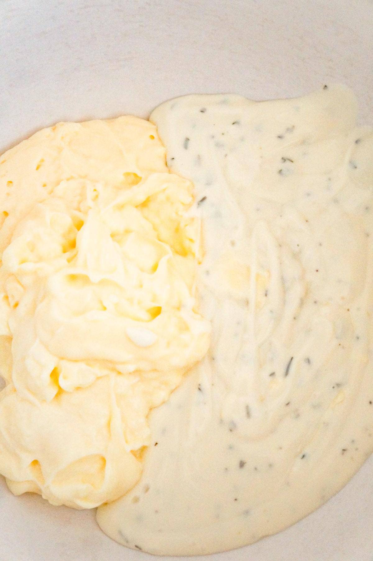 mayo and ranch dressing in a mixing bowl