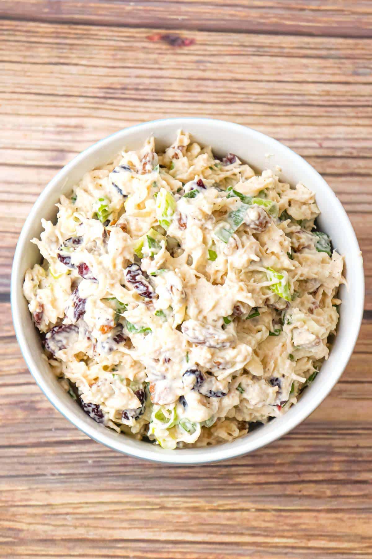 Chicken Salad with Cranberries is an easy cold lunch or dinner recipe using canned chicken and loaded with dried cranberries, chopped green onions, pecan pieces and shredded mozzarella cheese.