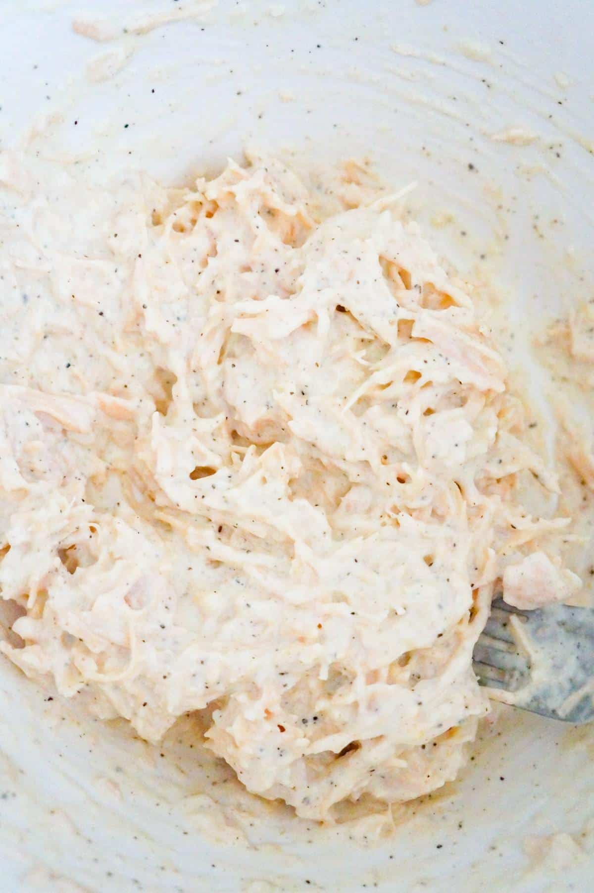 shredded chicken and mayo mixture in a mixing bowl