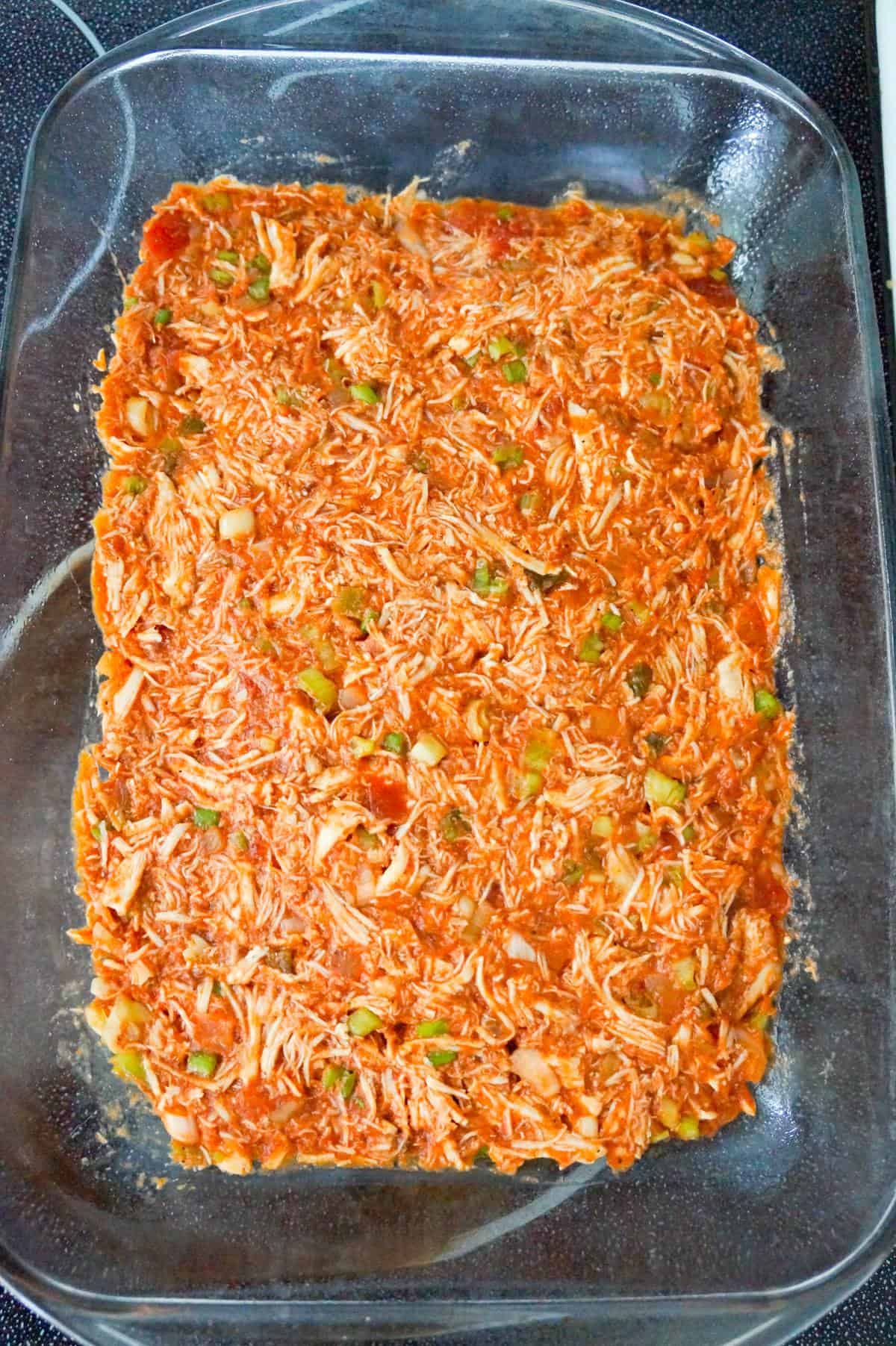 salsa and shredded chicken mixture in a baking dish