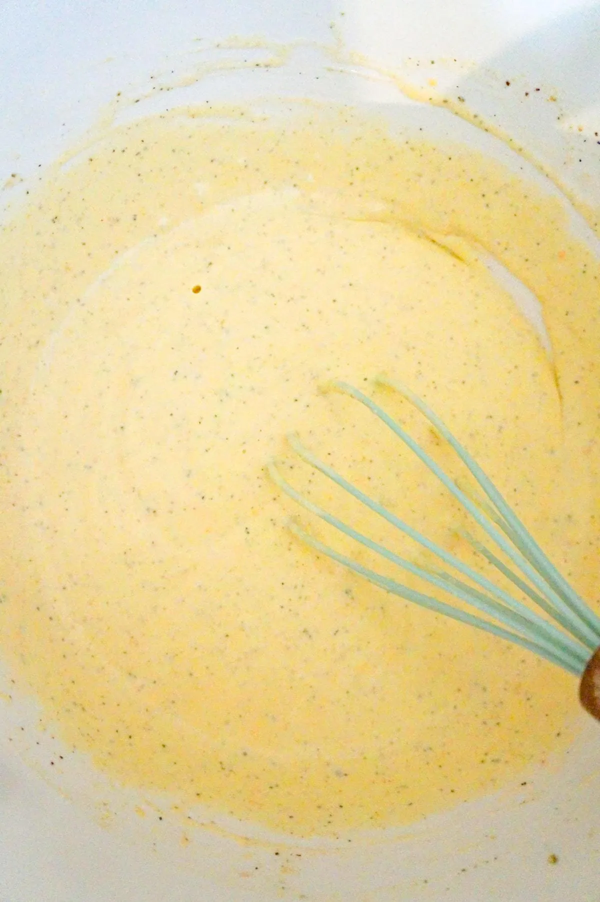 heavy cream and cheddar cheese soup mixture in a bowl