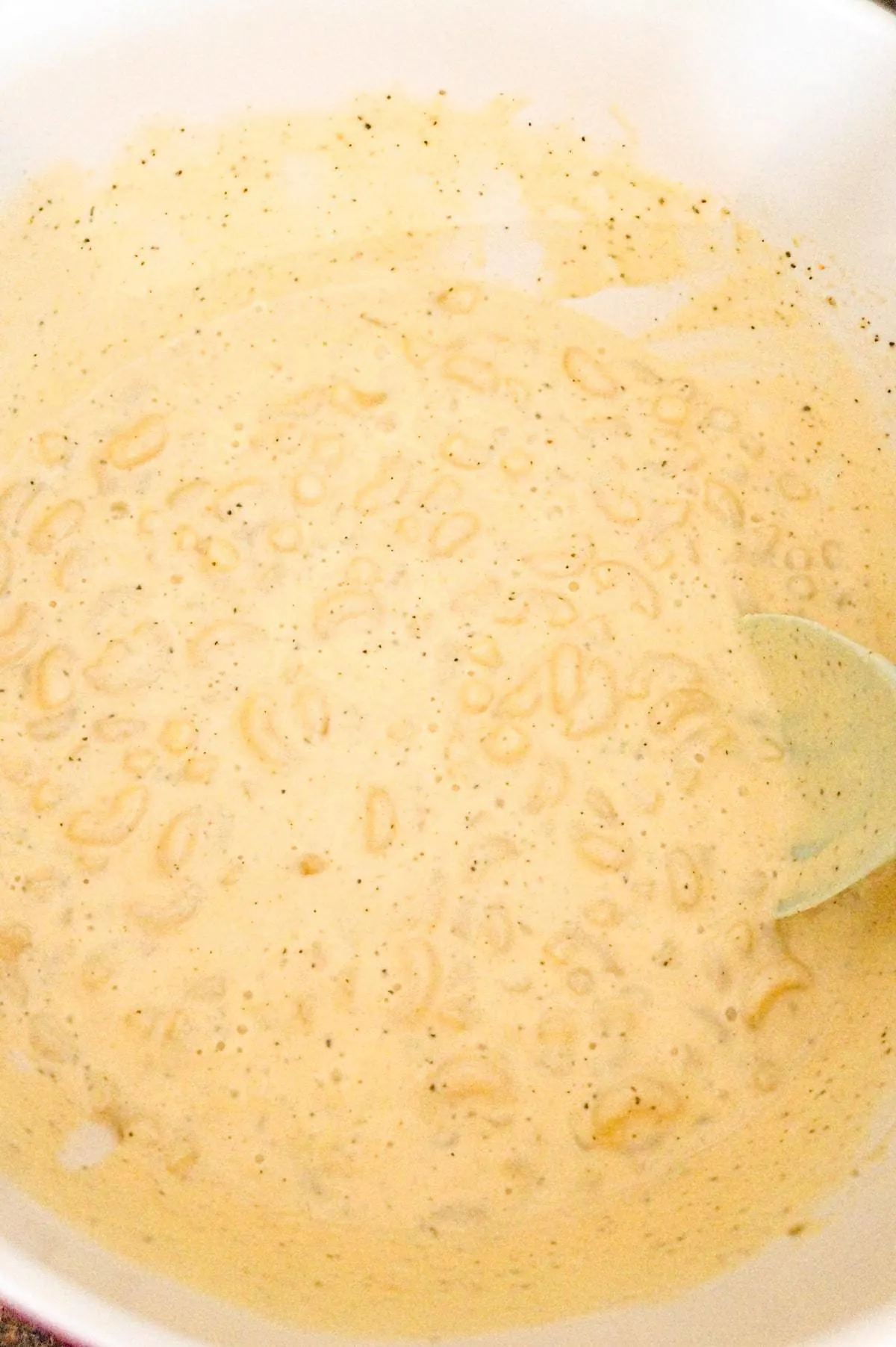 creamy macaroni in a mixing bowl