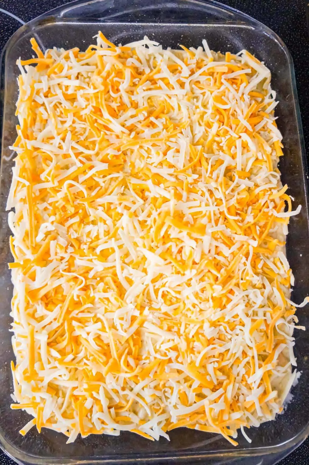 shredded cheese on top of mac and cheese
