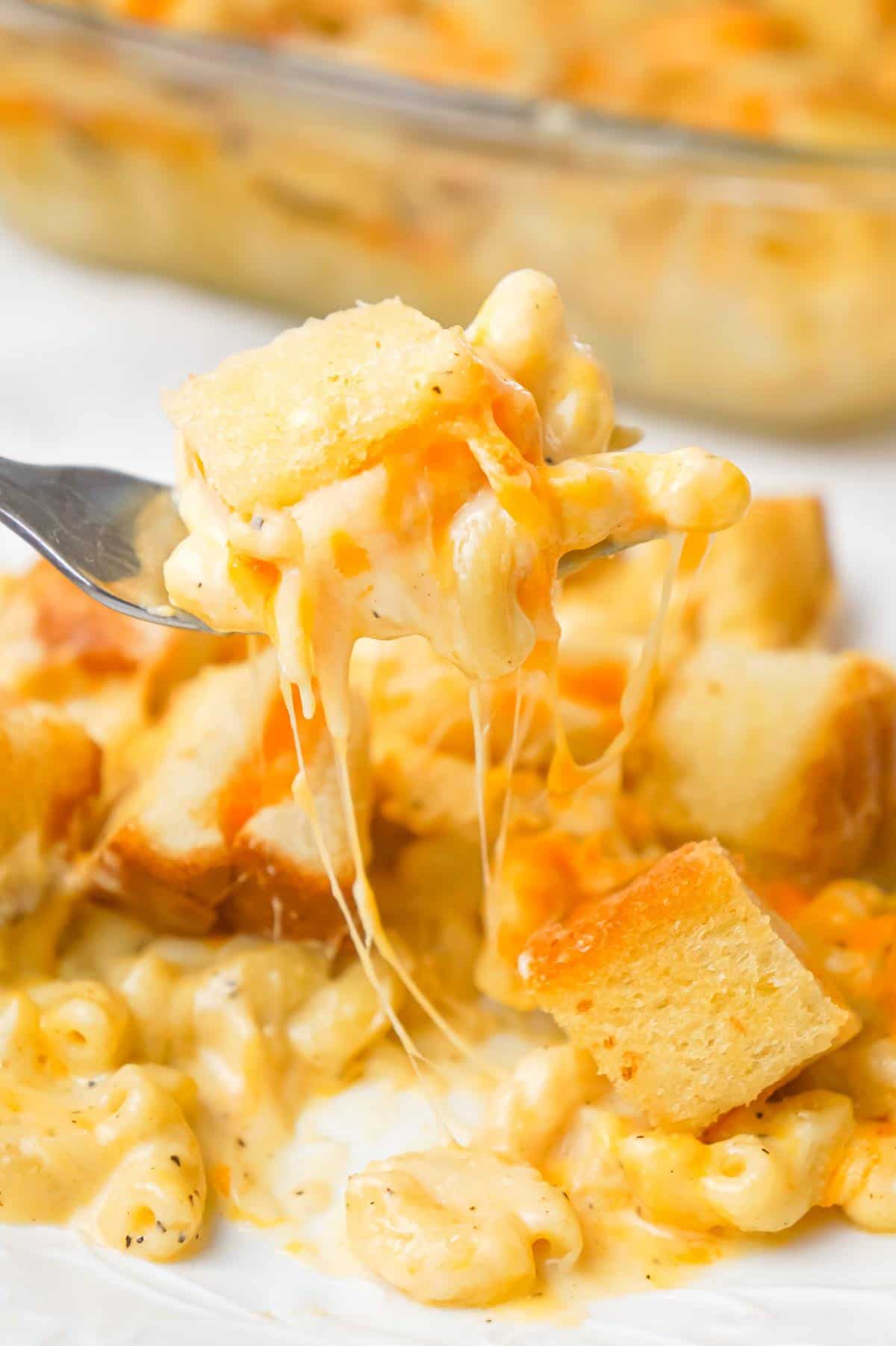 Grilled Cheese Mac and Cheese is a delicious baked macaroni and cheese recipe topped with bite sized pieces of grilled cheese sandwiches.