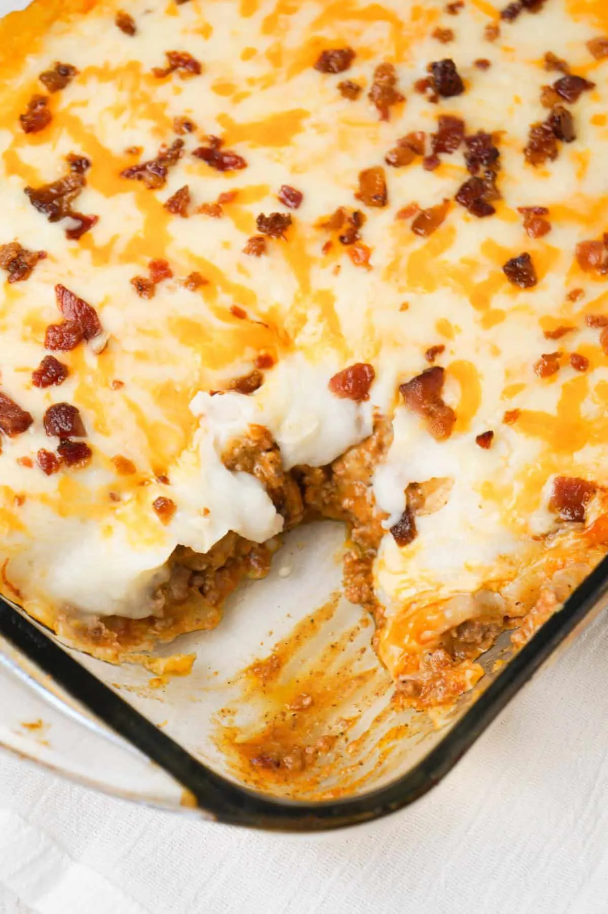 Bacon Cheeseburger Shepherd's Pie is an easy ground beef dinner recipe loaded with crumbled bacon, creamy mashed potatoes and shredded cheese.