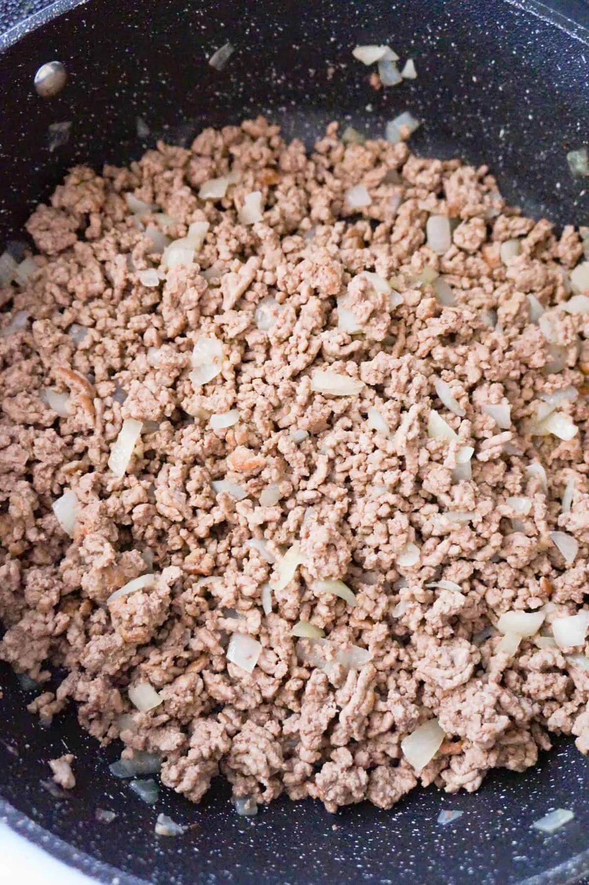 cooked ground beef in a large saute pan