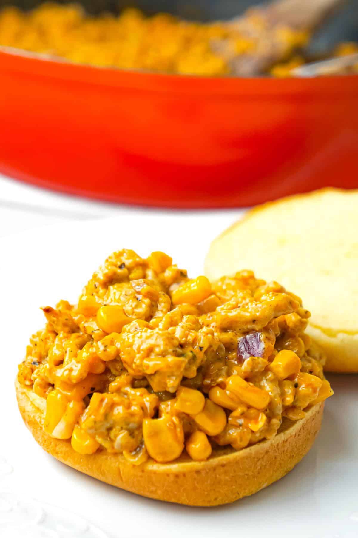 Cajun Chicken Sloppy Joes are an easy dinner recipe using ground chicken and loaded with corn, red onions, cream of chicken soup, Cajun seasoning and shredded cheese.