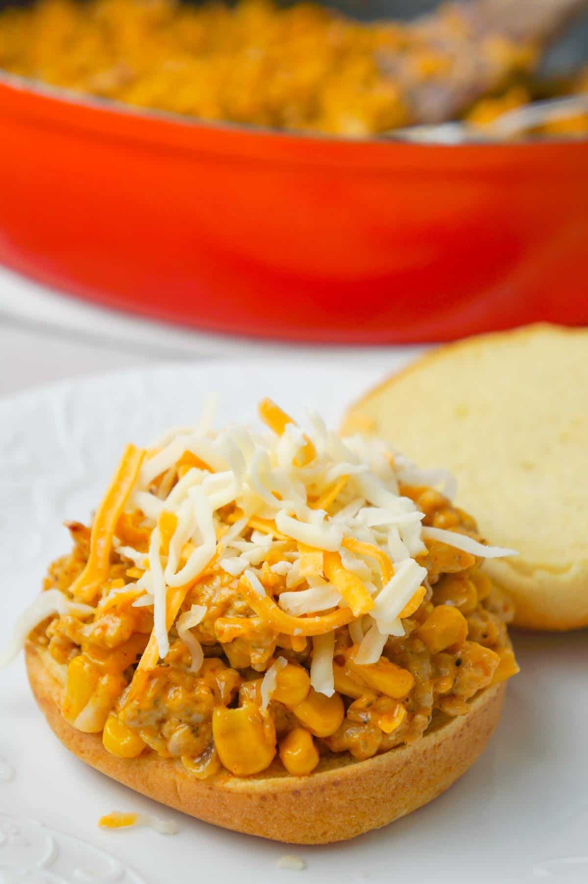 Cajun Chicken Sloppy Joes are an easy dinner recipe using ground chicken and loaded with corn, red onions, cream of chicken soup, Cajun seasoning and shredded cheese.
