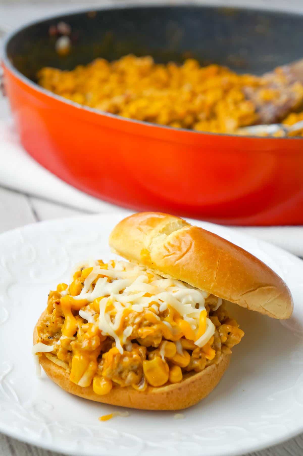 Cajun Chicken Sloppy Joes are an easy dinner recipe using ground chicken and loaded with corn, red onions, cream of chicken soup, Cajun seasoning and shredded cheese.