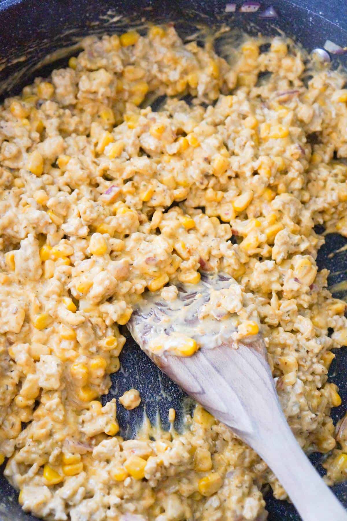 ground chicken mixture cooking in a saute pan