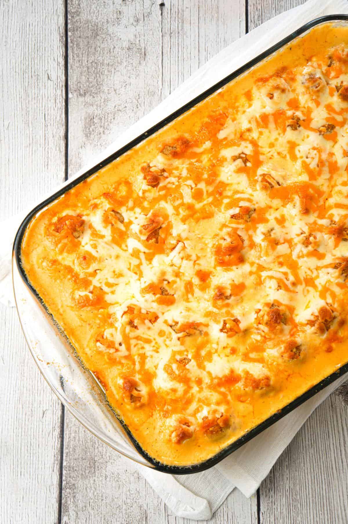 Buffalo Chicken Mac and Cheese is a baked pasta recipe loaded with crispy popcorn chicken, Buffalo sauce, ranch dressing, cheddar and mozzarella cheese.