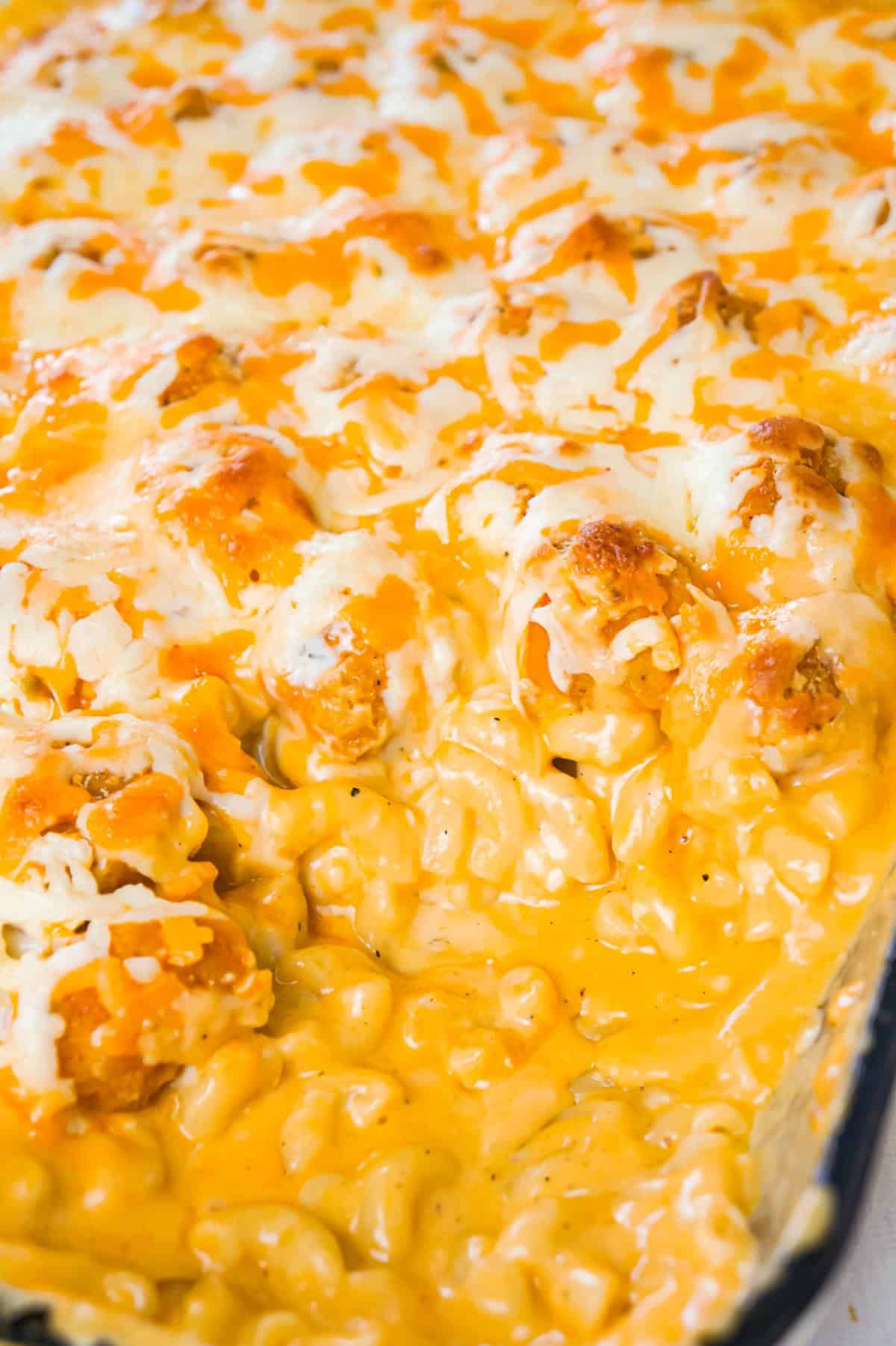 Buffalo Chicken Mac and Cheese is a baked pasta recipe loaded with crispy popcorn chicken, Buffalo sauce, ranch dressing, cheddar and mozzarella cheese.