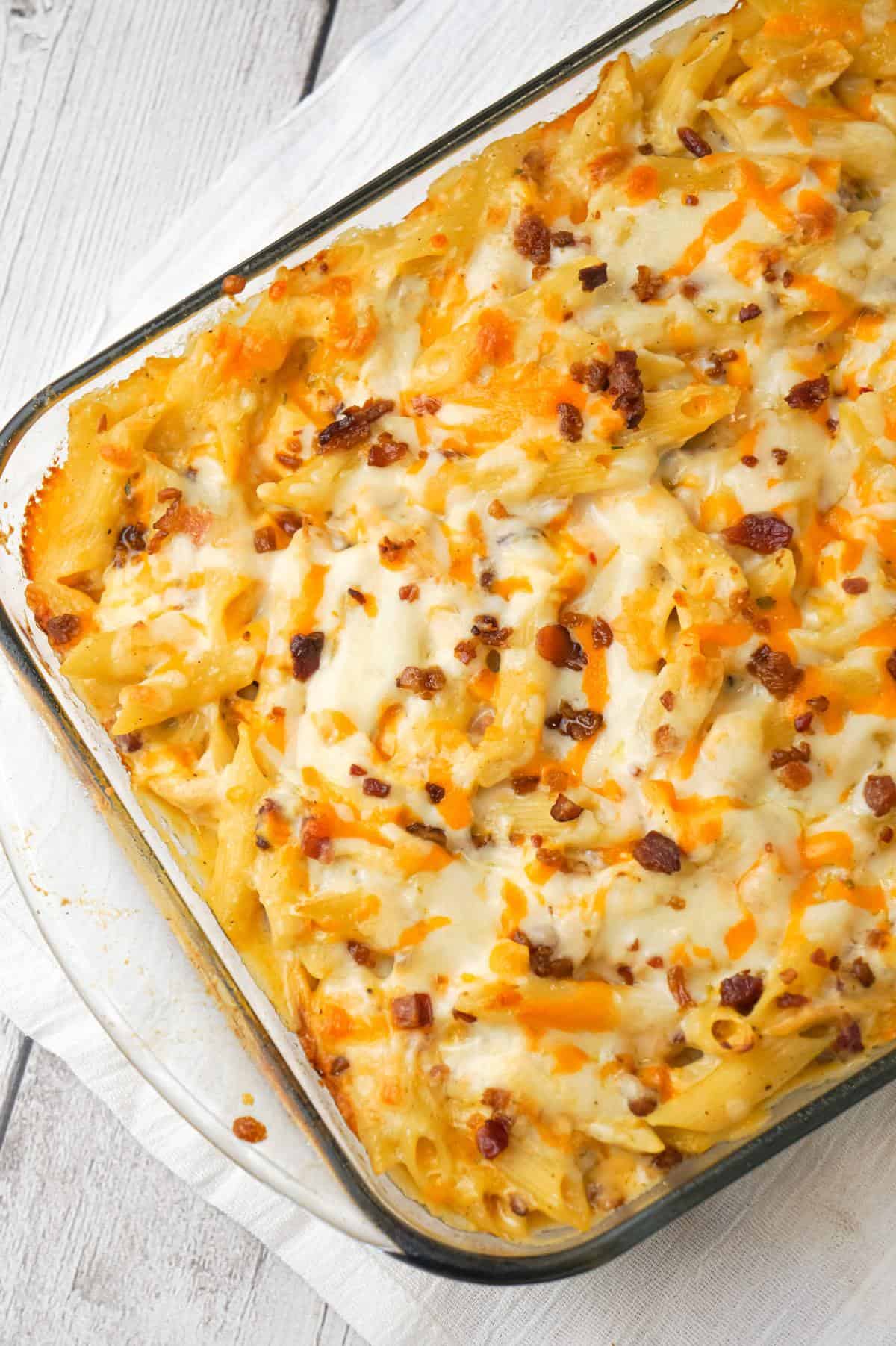 Cheddar Bacon Ranch Chicken Pasta is a delicious baked pasta recipe loaded with crumbled bacon, shredded chicken and cheddar cheese all in a creamy sauce made with cheddar cheese soup, cream of bacon soup and ranch dip mix.