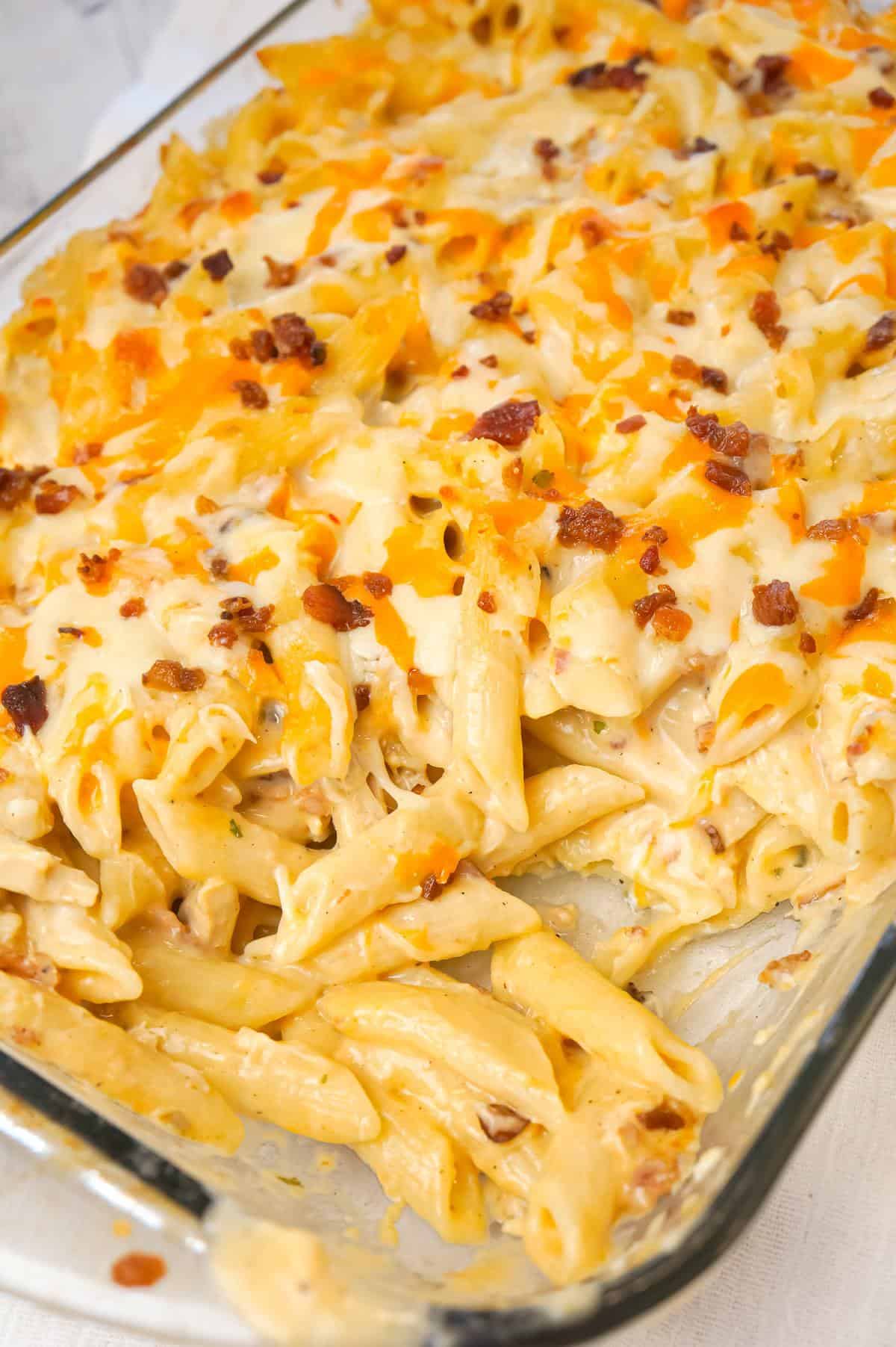 Cheddar Bacon Ranch Chicken Pasta is a delicious baked pasta recipe loaded with crumbled bacon, shredded chicken and cheddar cheese all in a creamy sauce made with cheddar cheese soup, cream of bacon soup and ranch dip mix.