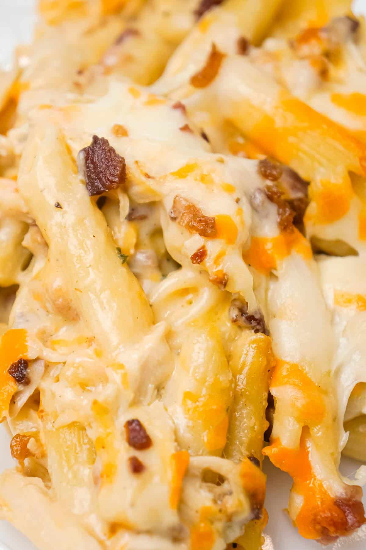 Cheddar Bacon Ranch Chicken Pasta is a delicious baked pasta recipe loaded with crumbled bacon, shredded chicken and cheddar cheese all in a creamy sauce made with cheddar cheese soup, cream of bacon soup and ranch dip mix.