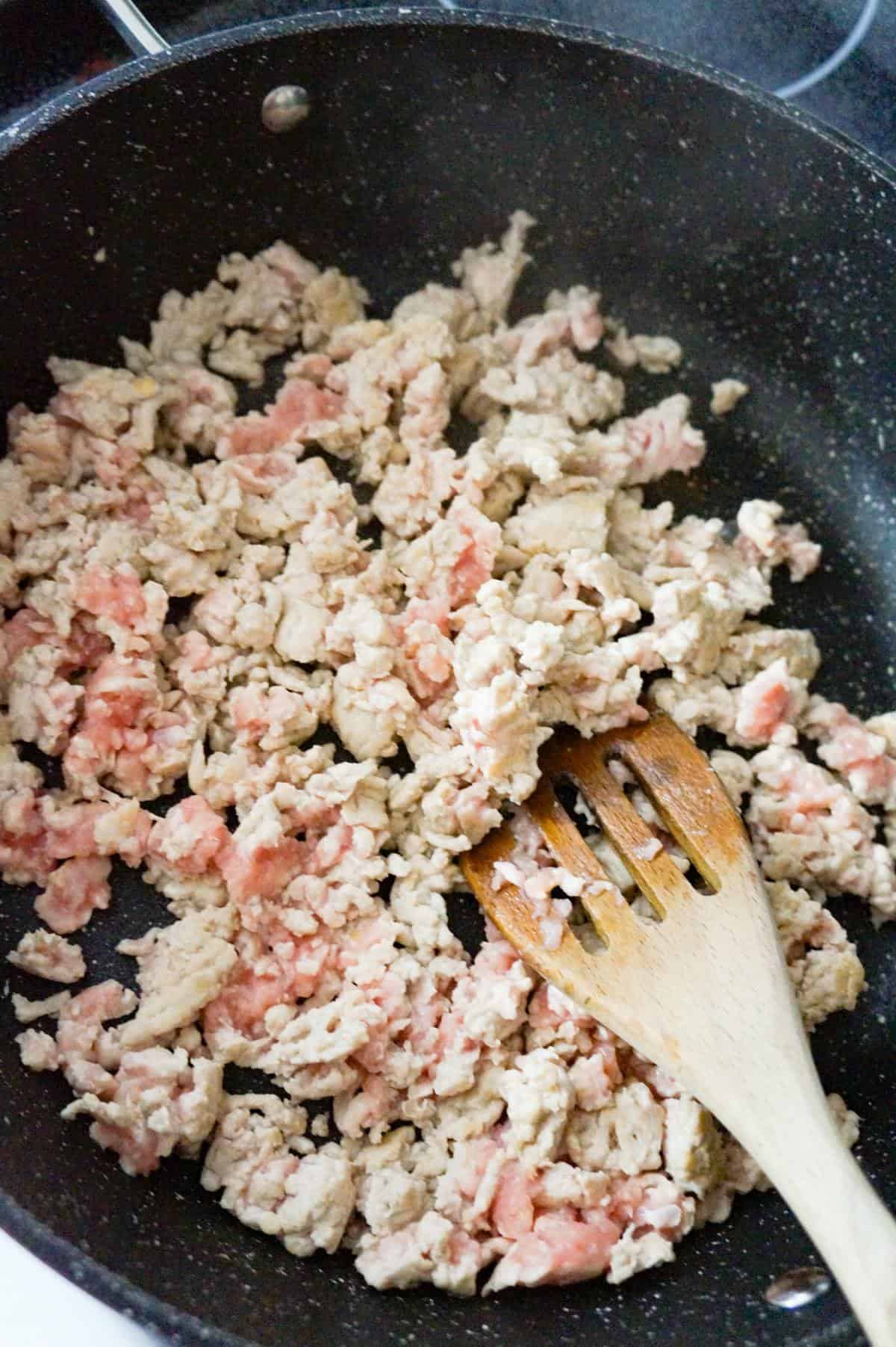 ground chicken cooking in a saute pan