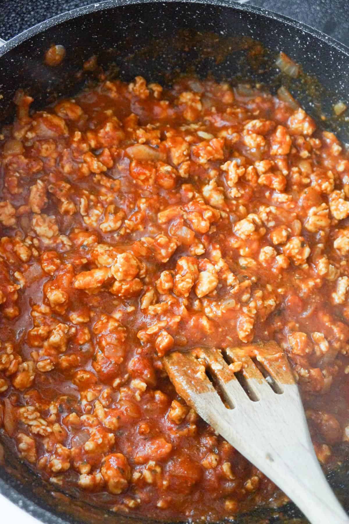 ground chicken and marinara mixture in a saute pan