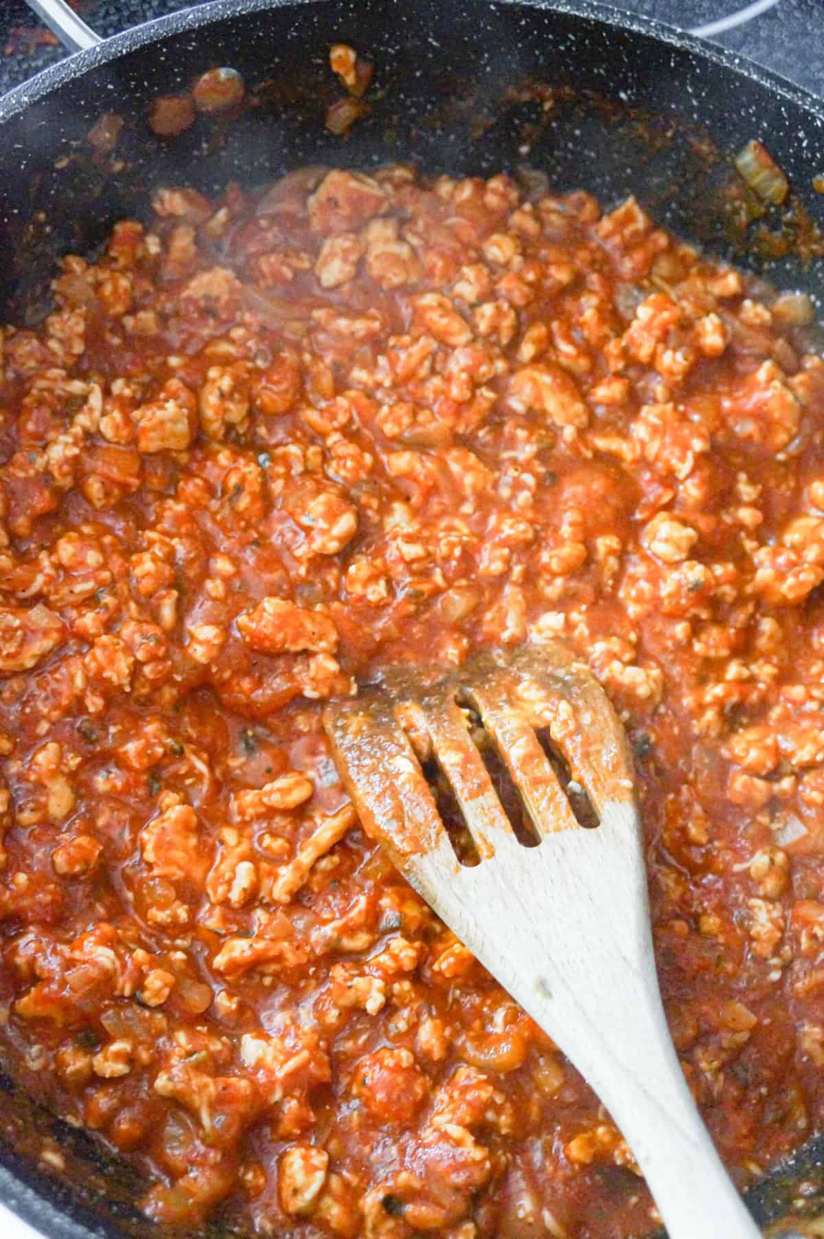 ground chicken sloppy joe mixture in a large saute pan with marinara